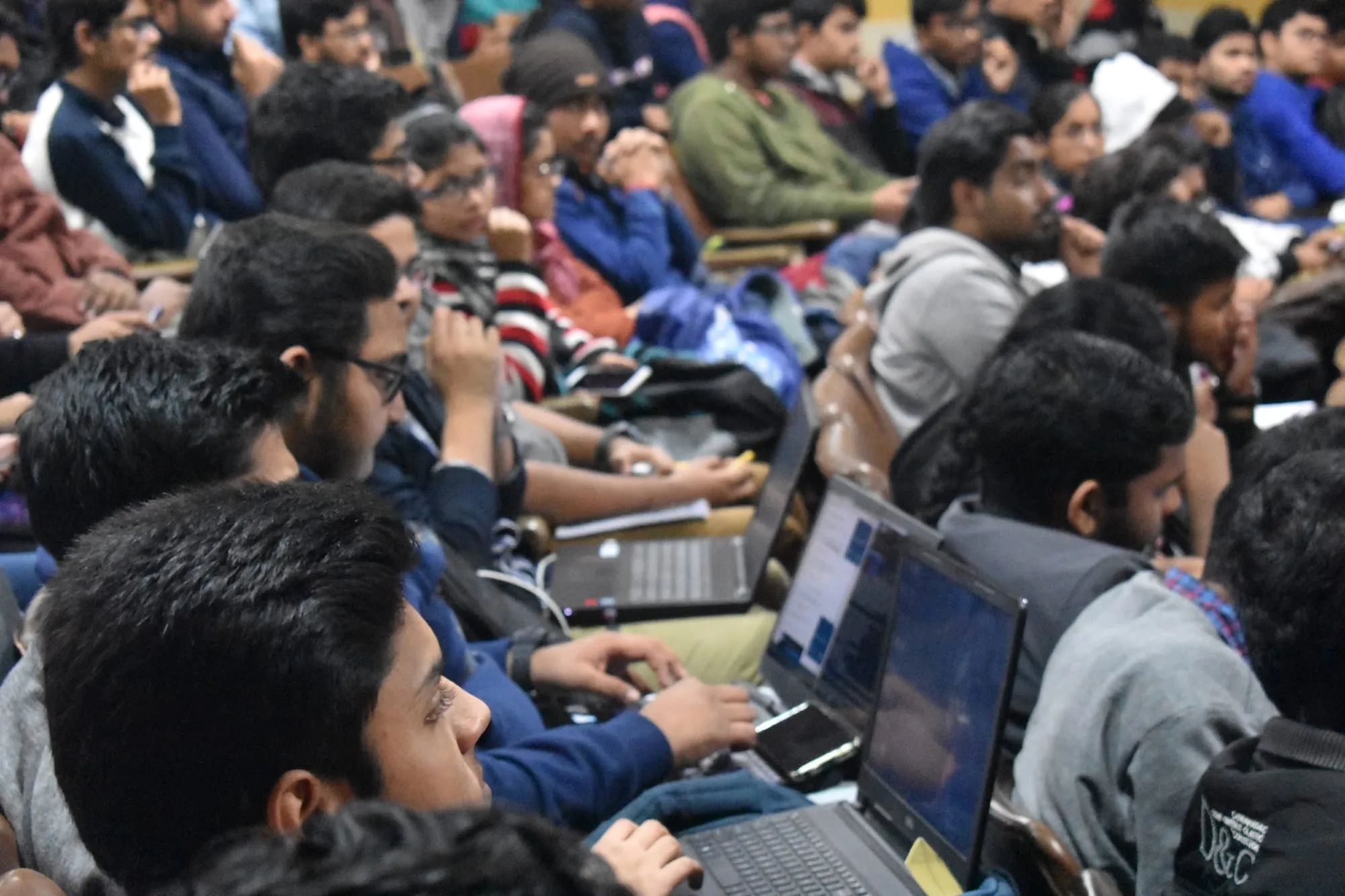 Students following the session on their laptops.